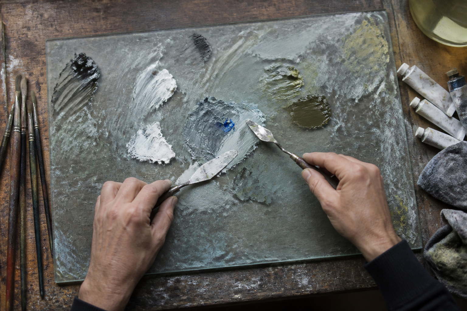 Paint colors being mixed by hand in the MioGallery studio